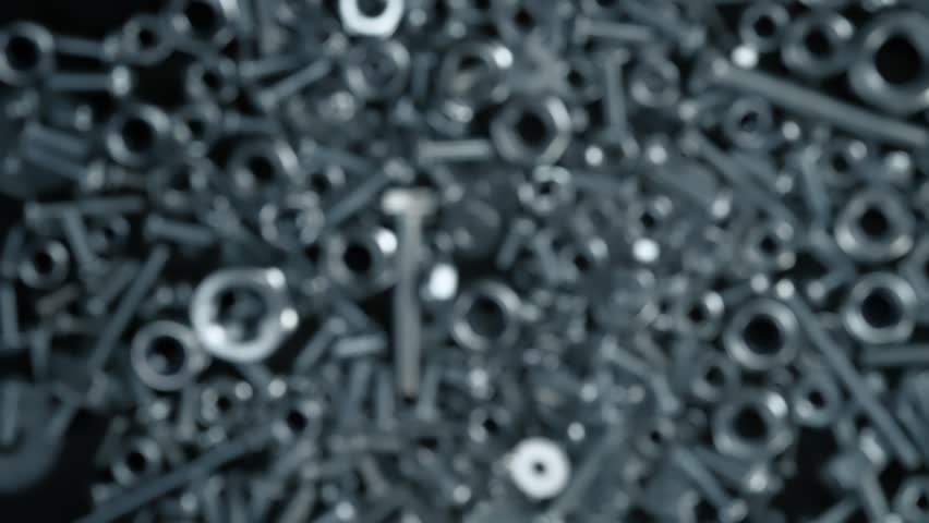 Super Slow Motion Shot of Fasteners Explosion Towards Camera Isolated on Black at 1000fps. Royalty-Free Stock Footage #1108122781