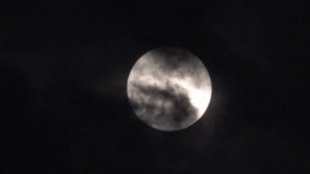 Full moon in the sky with clouds at night. Video footage of full moon in the sky with clouds at night. 1 Minute. 30 August 2023