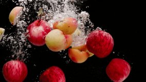 Fresh sliced apples falling into water, water splashes with fresh fruits in water black background - Powered by Shutterstock - Get 15% off with code: PIKWIZARD15