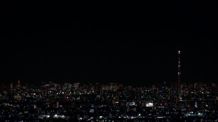 TOKYO, JAPAN : Sunrise time lapse shot of CITYSCAPE of TOKYO and MOUNT FUJI. View of buildings and street at downtown area. Japanese urban city life and nature concept 4K video. Night to morning shot.