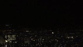 TOKYO, JAPAN : Aerial high angle sunrise view of CITYSCAPE of TOKYO and MOUNT FUJI. Sun rising behind mountains. Japanese urban city life and nature concept video. Time lapse shot, night to morning.