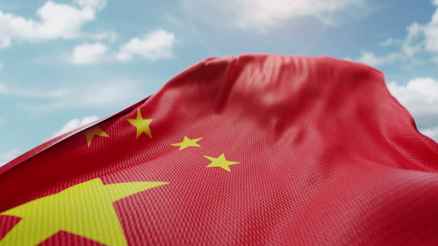 Wavy flag of China blowing in the wind in slow motion. Waving colorful Chinese flag team symbol abstract vertical background. Blue sky with clouds. World countries flying flags concept