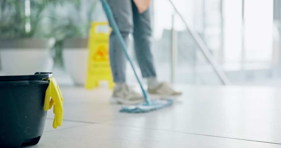 Cleaning, person and mop on floor of office for cleaner service, professional janitor and maintenance. Manual labor, wet sign and worker with tools for hygiene, disinfection and washing in workplace Royalty-Free Stock Footage #1108138087