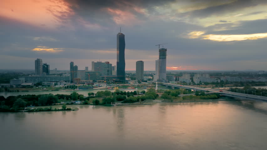 Vienna aerial skyline view at sunrise, vienna city austria fly over river at sunset, vienna skyscrapers.