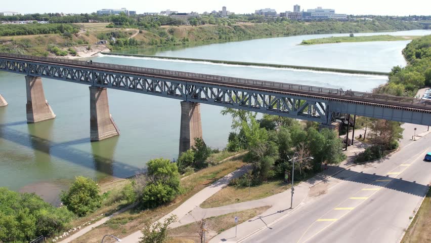 Aerial video of City Park, Saskatoon, SK, revealing its vibrant streets, urban green spaces, and historic architecture. A blend of city life and nature, ideal for urban exploration.