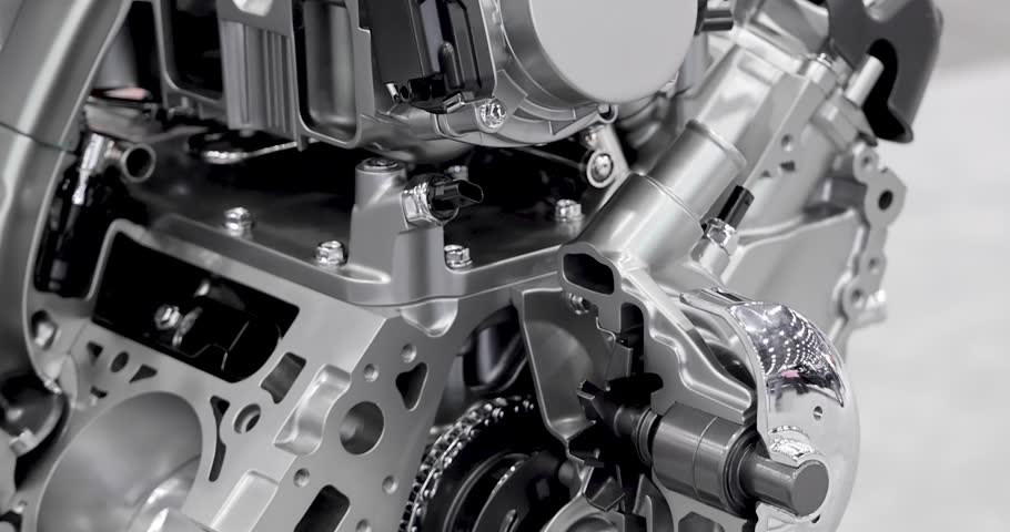 Close up view of cut section of  shiny Automotive Internal combustion engine details.