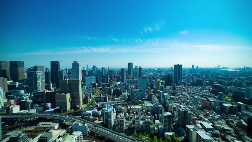 A timelapse of panorama cityscape near the railway in Osaka wide shot zoom Royalty-Free Stock Footage #1108149243