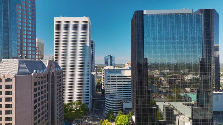 Aerial view of downtown district of Charlotte city in North Carolina, USA. Glass and steel high skyscraper buildings in modern american midtown.