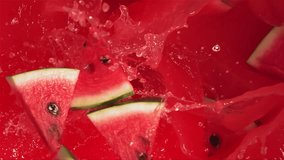 Super Slow Motion Shot of Fresh Watermelon Slices Falling into Red Juice Whirl - Powered by Shutterstock - Get 15% off with code: PIKWIZARD15