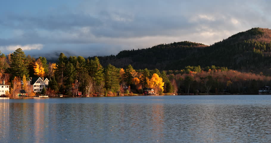 Lake Placid village reflects over Mirror Lake in the Adirondack Mountains of New York State
