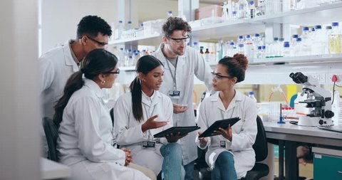 People, scientist and tablet in meeting, planning or research for project or discovery in science laboratory. Group of medical health students in team plan, scientific learning and technology at lab Video Stok