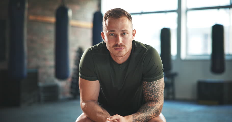 Gym, fitness and face of man athlete serious for wellness, exercise and health as a coach with workout commitment. Active, sports and portrait young bodybuilder in training centre or club for goals Royalty-Free Stock Footage #1108169417