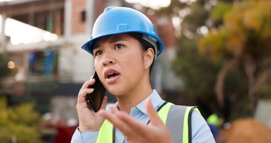 Frustrated asian woman, architect and phone call in mistake, disagreement or argument on construction site. Female person, engineer or contractor talking on mobile smartphone in serious discussion Royalty-Free Stock Footage #1108170045