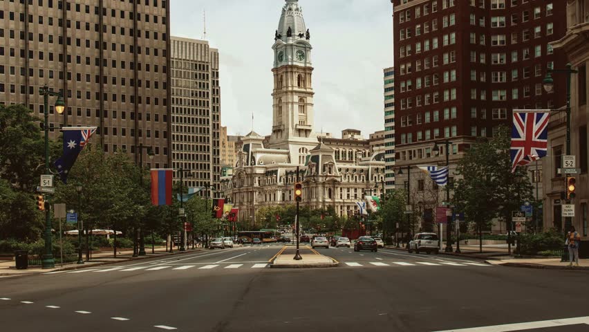 Downtown street view timelapse with City Hall bell tower and urban buildings cityscape in Philadelphia in Pennsylvania USA