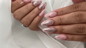 In this captivating video, we present a close-up look at a stunning nail art design. With the addition of the shimmering silver butterflies and bling bling.
