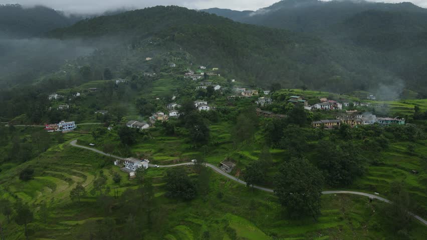 Aerial shot of a small village situated in mountains. Village of uttarakhand. Royalty-Free Stock Footage #1108180687