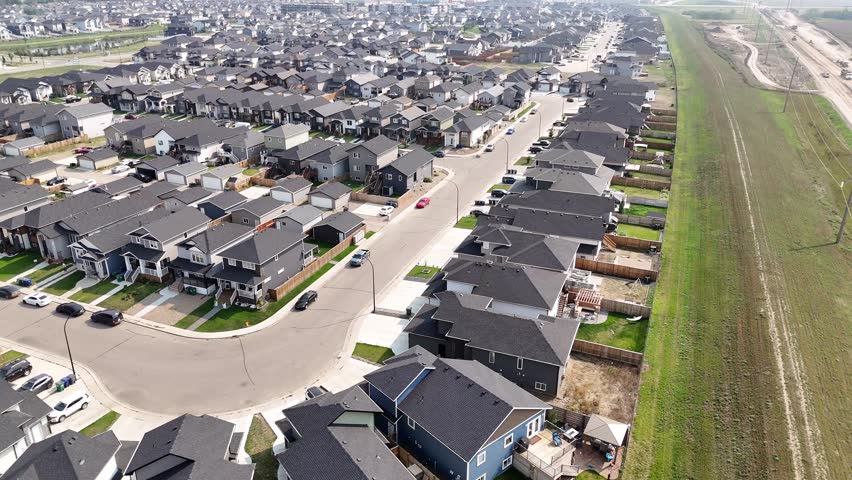 Aerial video of Kensington, Saskatoon, SK, displaying its modern homes, commercial hubs, and vibrant community spaces. A burgeoning neighborhood reflecting contemporary urban living. 