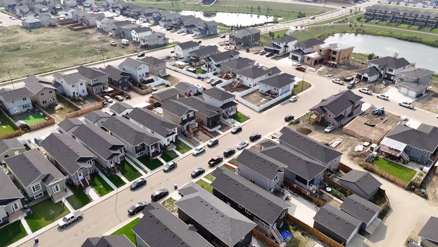 Aerial video of Kensington, Saskatoon, SK, displaying its modern homes, commercial hubs, and vibrant community spaces. A burgeoning neighborhood reflecting contemporary urban living. 