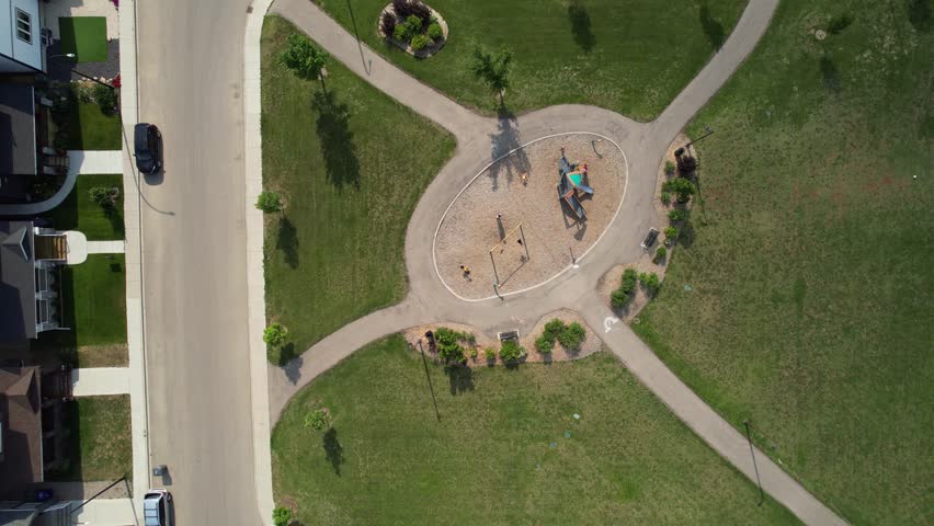 Aerial video of Kensington, Saskatoon, SK, displaying its modern homes, commercial hubs, and vibrant community spaces. A burgeoning neighborhood reflecting contemporary urban living. 
