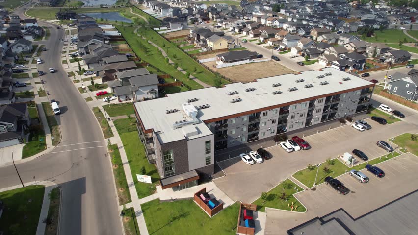 Aerial video of Kensington, Saskatoon, SK, displaying its modern homes, commercial hubs, and vibrant community spaces. A burgeoning neighborhood reflecting contemporary urban living. 
