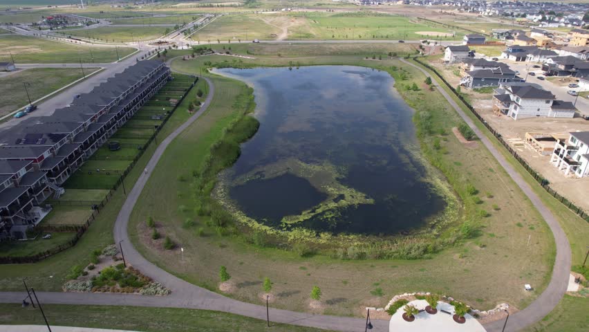 Aerial video of Kensington, Saskatoon, SK, displaying its modern homes, commercial hubs, and vibrant community spaces. A burgeoning neighborhood reflecting contemporary urban living. 