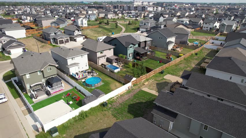 Aerial video of Kensington, Saskatoon, SK, displaying its modern homes, commercial hubs, and vibrant community spaces. A burgeoning neighborhood reflecting contemporary urban living. 