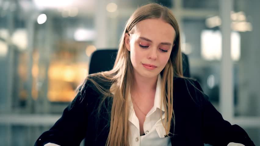 Frustrated millennial female worker sitting in middle of table with colleagues and cries because of the excessive workload stress and aggression of the people around her at modern office workplace Royalty-Free Stock Footage #1108192393