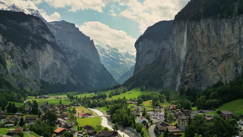 Fly over Swiss alpine village Lauterbrunnen. Aerial view of lauterbrunnen valley in Switzerland. Gorgeous mountains with glaciers, waterfalls and valley - nature of Swiss Alps Royalty-Free Stock Footage #1108196325
