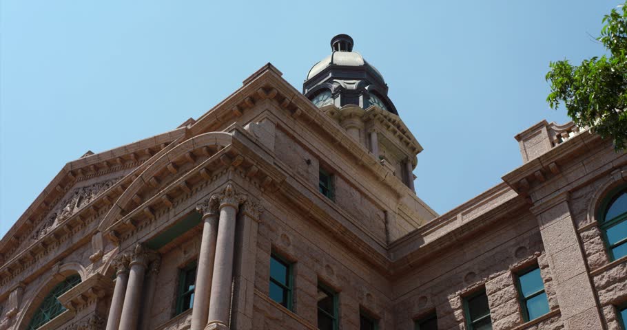 Low angle wide shot of the Tarrant County Courthouse in Fort Worth, Texas