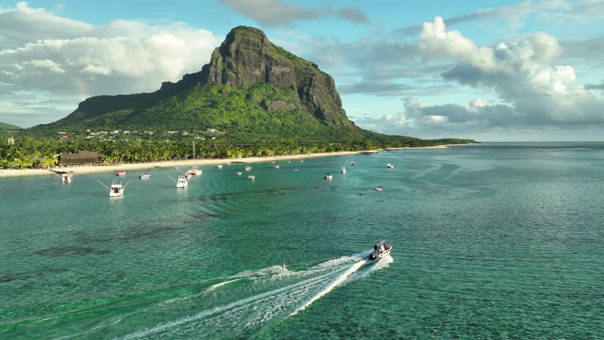 Aerial view: Luxury tropical beach, yachts, water sky and Le Morne mountain in Mauritius. Royalty-Free Stock Footage #1108205493