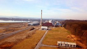 Stunning 4K drone footage of the sugar factory in Ormož in Prlekija. Its tall chimney is visible from a distance. The factory is located next to the railway. Cinematic video taken in autumn.