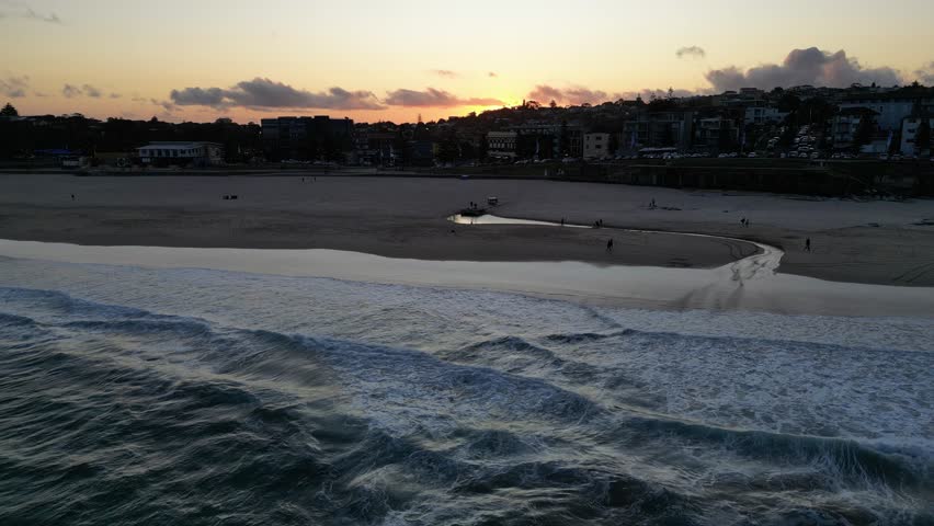 Surfers enjoying the sunset at Maroubra Beach, Sydney, New South Wales, Australia.