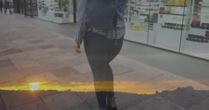 Animation of spots of light over caucasian woman walking in city street. Lifestyle, urban living and happiness concept digitally generated video.