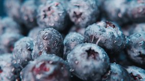 4K Motioned close-up footage showing blueberries with water droplets.