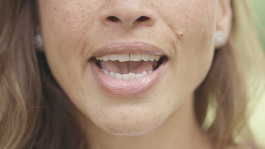 Close up of female mouth talking to camera in a Vox pop style Royalty-Free Stock Footage #1108217527