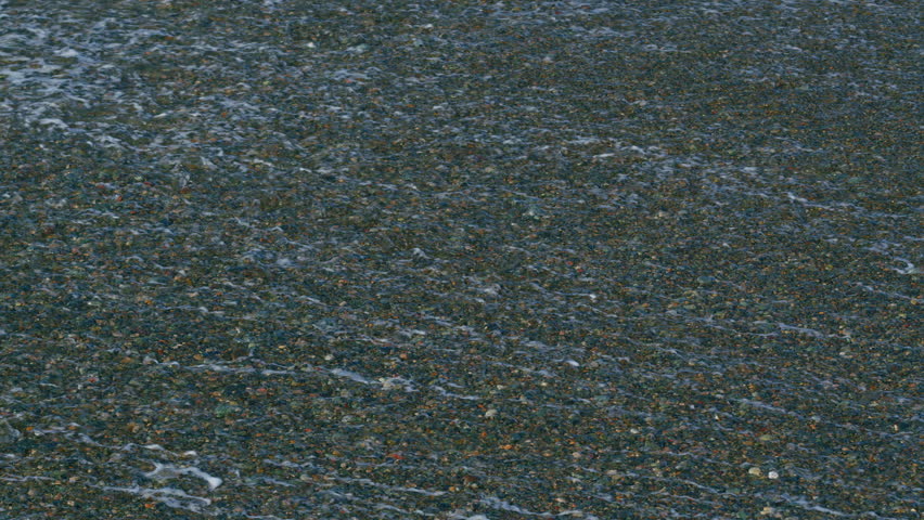 Waves Breaking On The Beach Of Pebble Surf On The Beach. Waves Washing The Pebble Beach. Slow motion.