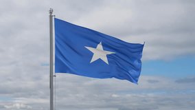 Somalia looped flag waving in the wind with blue sky and running clouds, cycle seamless loop video