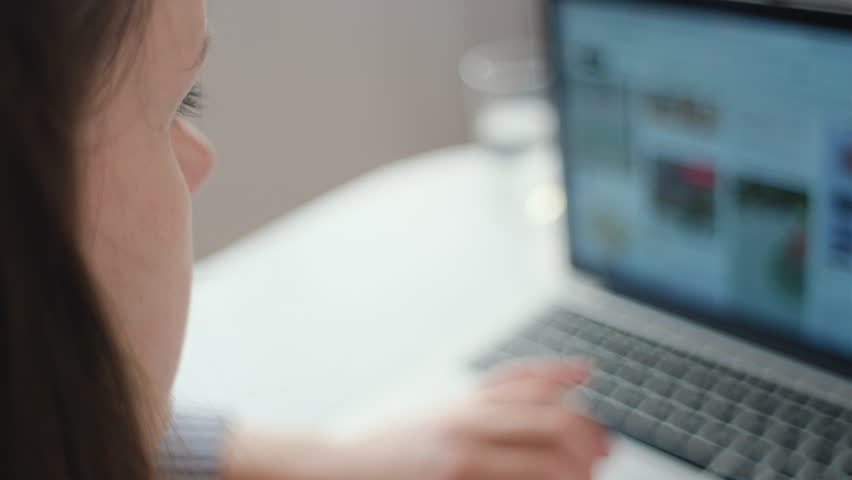 Selective focus of young woman sit at desk working on laptop feel tired, reducing pain, eyes exhaustion, suffers from dry eyes due long usage of modern device. Eye strain and blurry vision concept Royalty-Free Stock Footage #1108228139