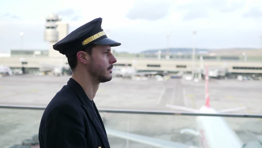 Portrait of Proffesional Male Pilot Captain Working in Aviation Business