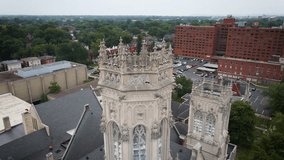 Experience the architectural splendor of an old church from a unique vantage point, capturing the intricate details and timeless beauty of its rooftop.
