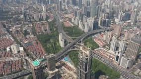 Aerial view of converging roads at massive intersection in Shanghai city, urban infrastructure and transportation in China