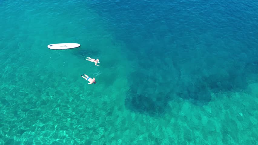 Aerial view of swimmers in Cala cerrada beach at the south of Spain during summertime  | Shutterstock HD Video #1108238007