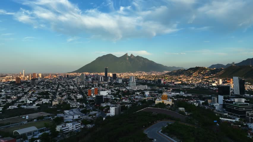 Aerial view rising over the Bishopric Hill, sunny evening in Monterrey, Mexico Royalty-Free Stock Footage #1108241349