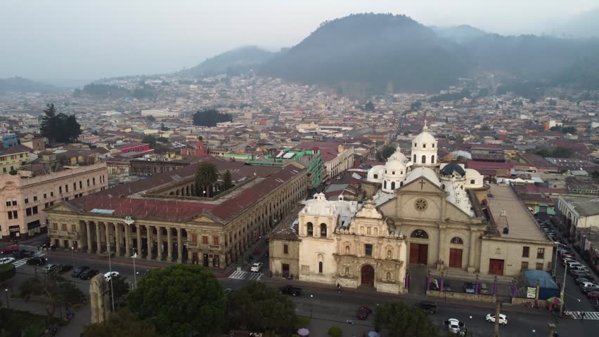 Modern Catholic church built behind façade of Quetzaltenango Cathedral Royalty-Free Stock Footage #1108241355