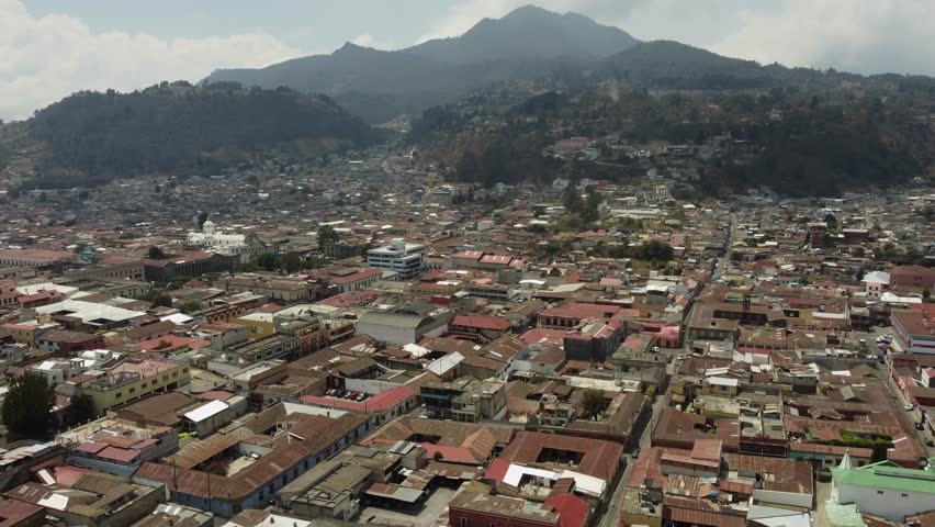 City aerial tilts to streets of Quetzaltenango in Guatemala mountains Royalty-Free Stock Footage #1108241695