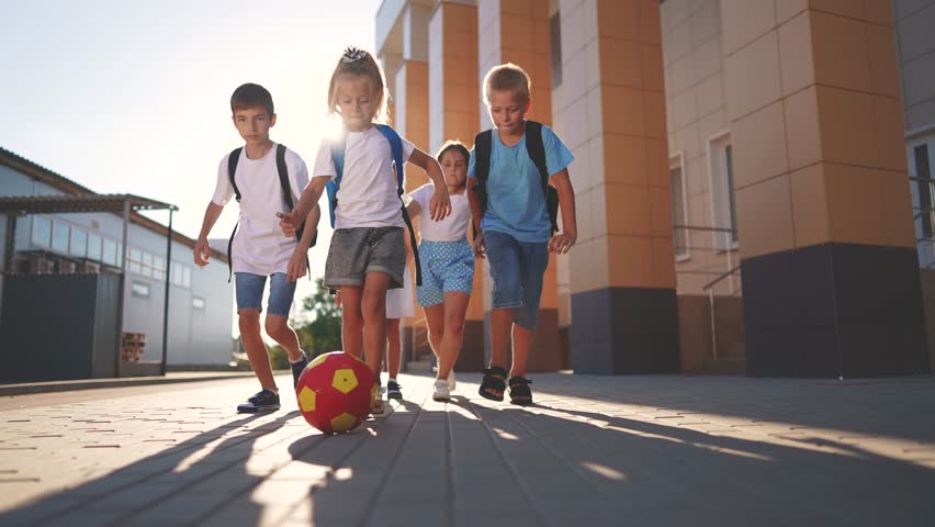 children near the school playing soccer. kids a school education kid dream concept. a group of children near the school playing ball. group of school children playing lifestyle soccer Royalty-Free Stock Footage #1108241941