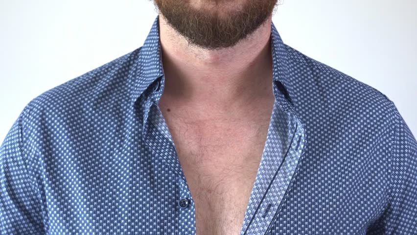 Hands buttoning a blue shirt not completely. Close-up of how to button the collar of a colored elegant shirt. Man adjusting his collar undoing top button. Relaxed feeling and formal outfit. | Shutterstock HD Video #1108244253