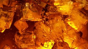 Super Slow Motion of Rotating Ice Cubes in Cola or Alcoholic Drink. Filmed on High Speed Cinema Camera, 1000 fps. Speed Ramp Effect. - Powered by Shutterstock - Get 15% off with code: PIKWIZARD15