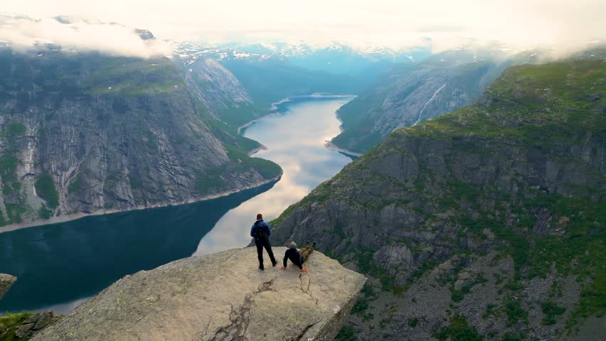 Sitting At The Edge Of Trolltunga Royalty-Free Stock Footage #1108248625