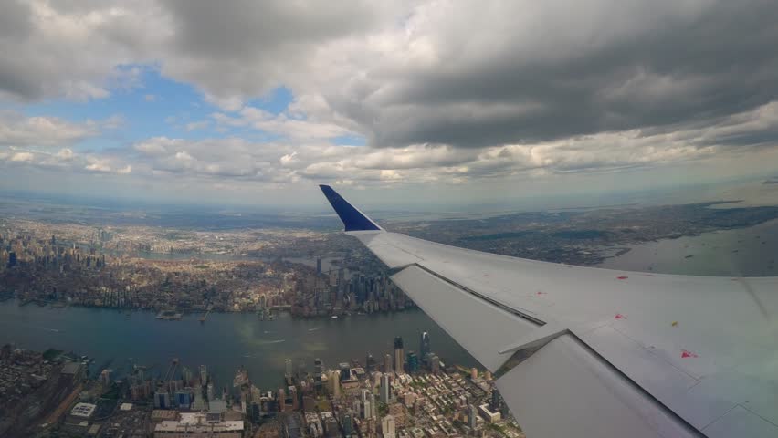 Plane Window View Flying Over Jersey City with Manhattan, Brooklyn, and Queens in the Background in the Afternoon. New York City, Northeast, America Royalty-Free Stock Footage #1108251265